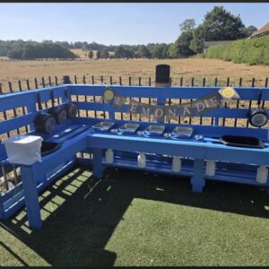 An image of a corner mud kitchen converted into a lemonade stand.